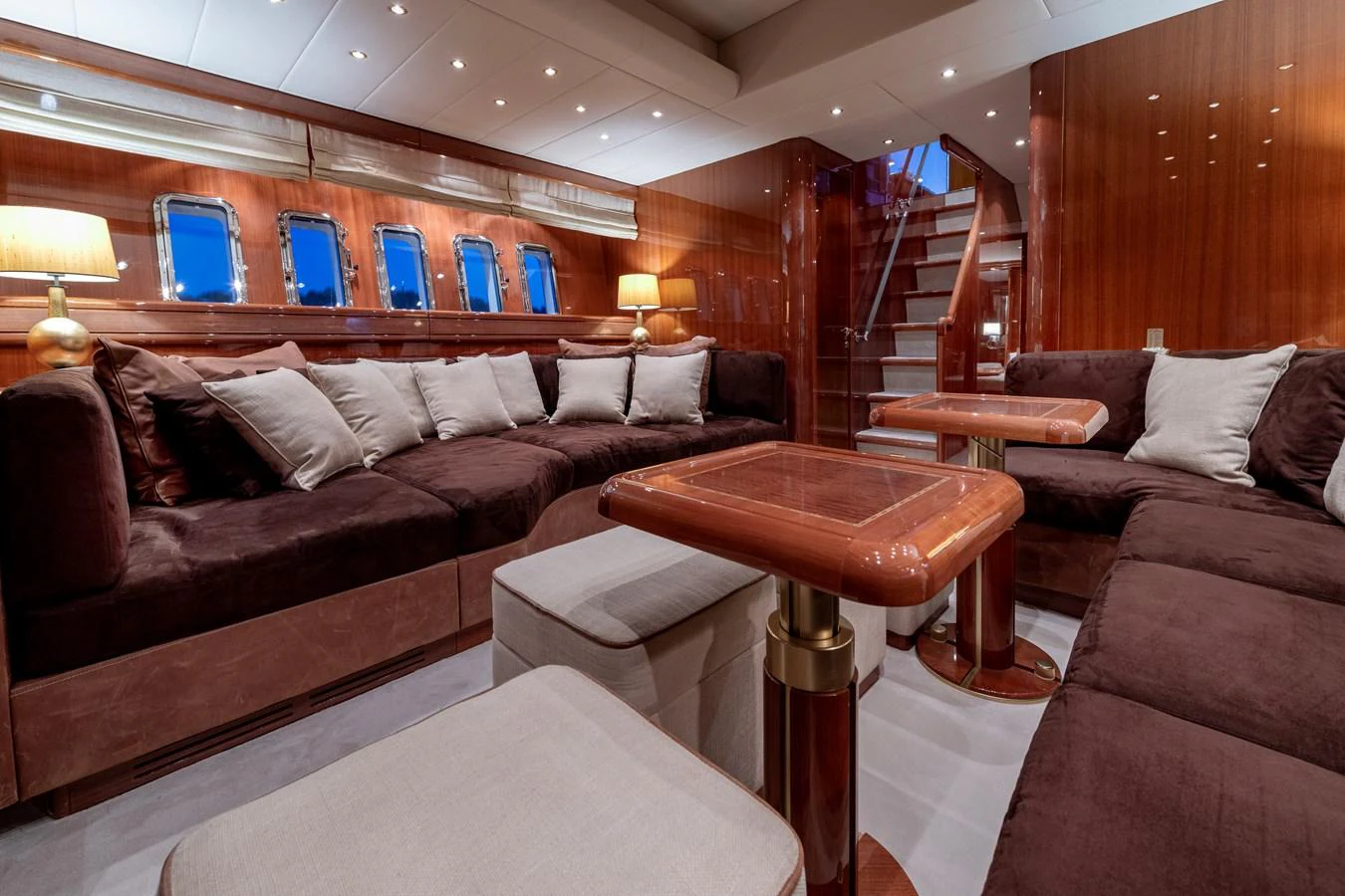 The salon features plush seating and elegant wooden accents, creating a warm and inviting atmosphere. aboard K GRACE Yacht for Sale