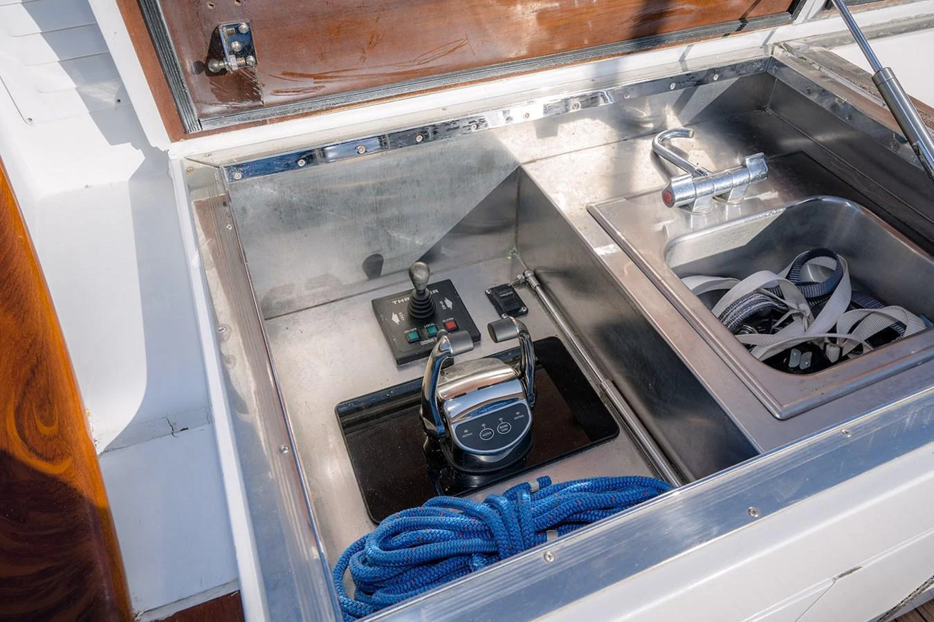 A close-up view of the yacht's control panel and storage compartment. aboard MAMA BEAR Yacht for Sale