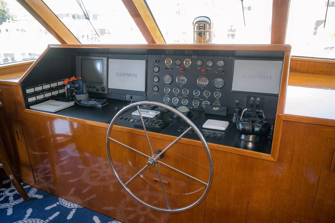 The helm station features a sophisticated control panel with modern navigation equipment. aboard MAMA BEAR Yacht for Sale