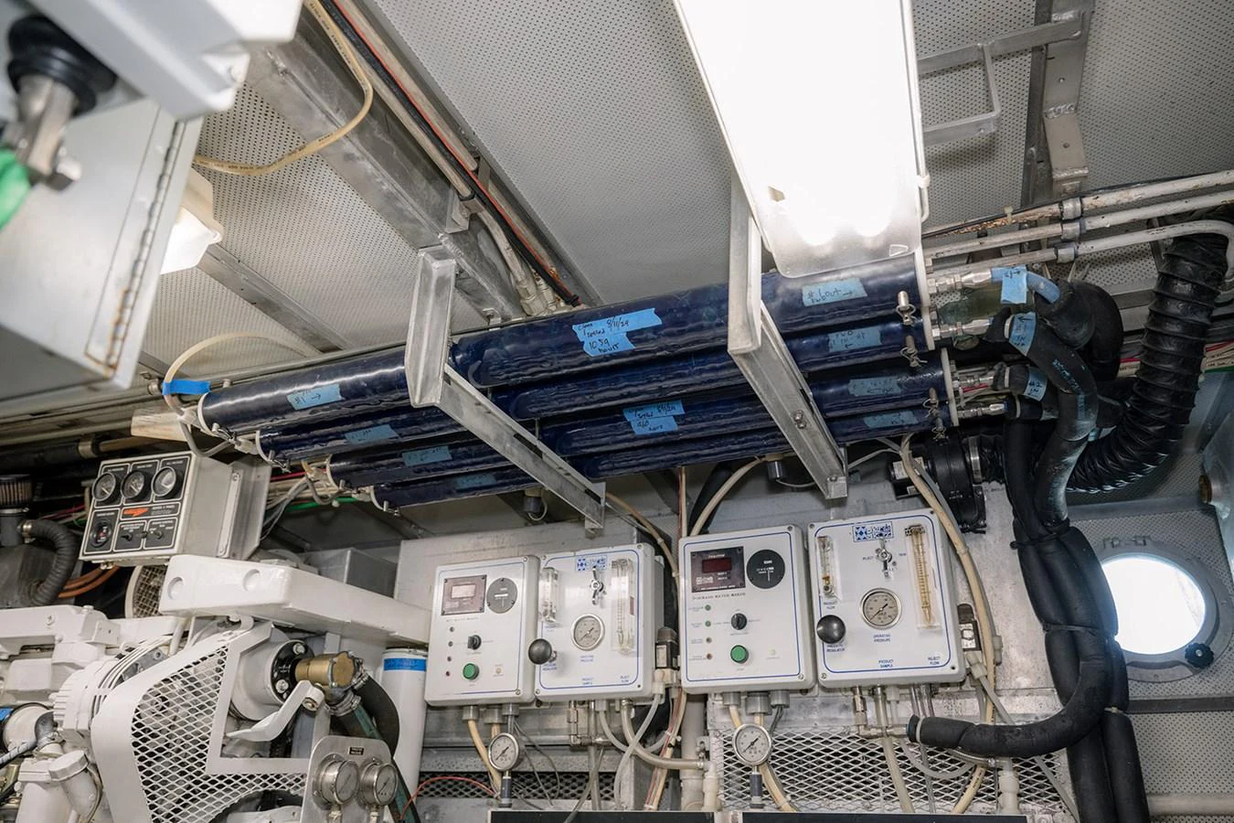 The image showcases the technical and mechanical components within the yacht's engine room. aboard MAMA BEAR Yacht for Sale