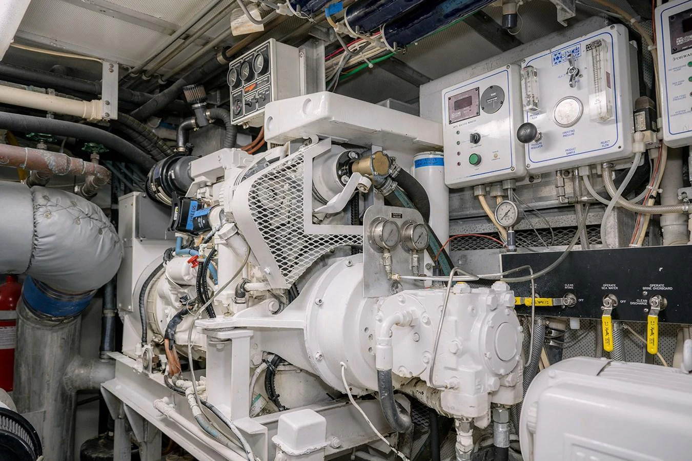 The image showcases the yacht's well-maintained engine room with advanced machinery and control panels. aboard MAMA BEAR Yacht for Sale