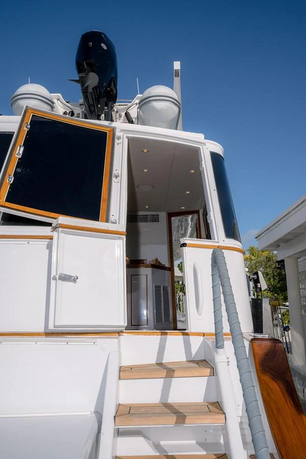 The image showcases the entrance to the yacht with a view of the steps leading up to the deck. aboard MAMA BEAR Yacht for Sale