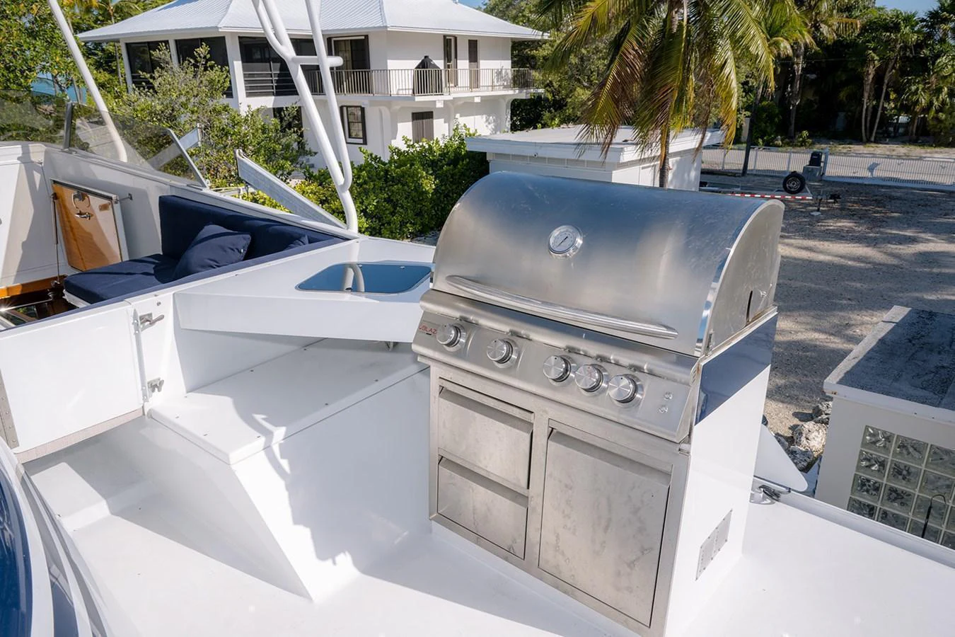 The yacht features a sleek stainless steel grill area, perfect for outdoor cooking and entertaining. aboard MAMA BEAR Yacht for Sale