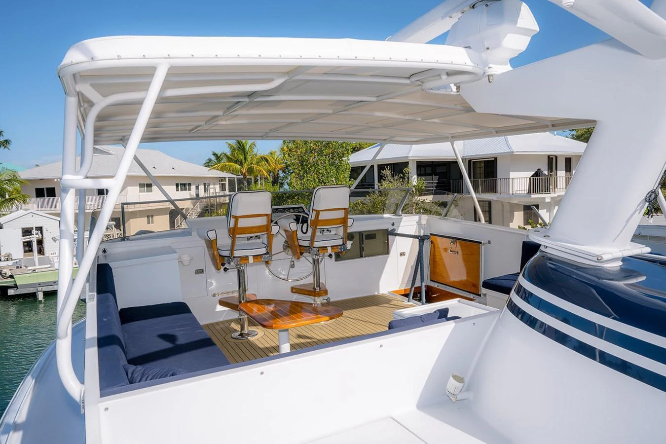 The flybridge offers a spacious and comfortable area for navigation and relaxation. aboard MAMA BEAR Yacht for Sale