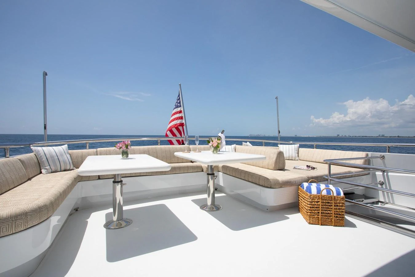 The aft deck offers a spacious and inviting seating area with a stunning ocean view. aboard PRIME TIME Yacht for Sale