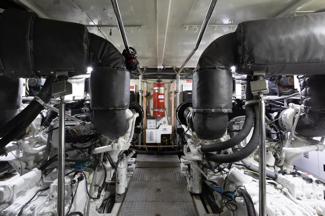 The image showcases the yacht's well-maintained engine room with advanced machinery. aboard PRIME TIME Yacht for Sale