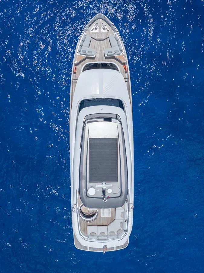 Aerial view of a sleek yacht cruising on deep blue waters. aboard LIFE Yacht for Sale