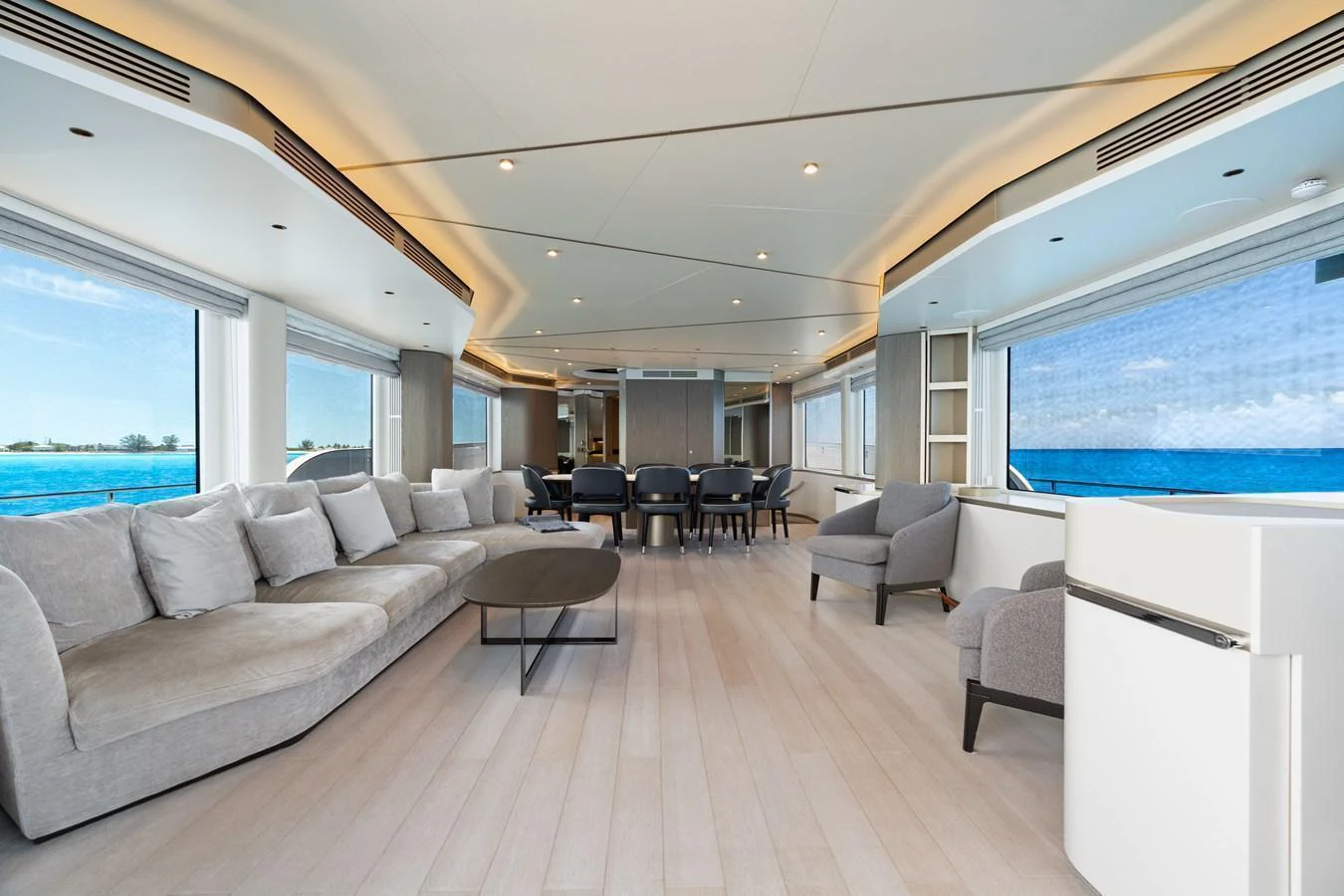 The spacious salon offers panoramic ocean views and luxurious seating arrangements. aboard LIFE Yacht for Sale