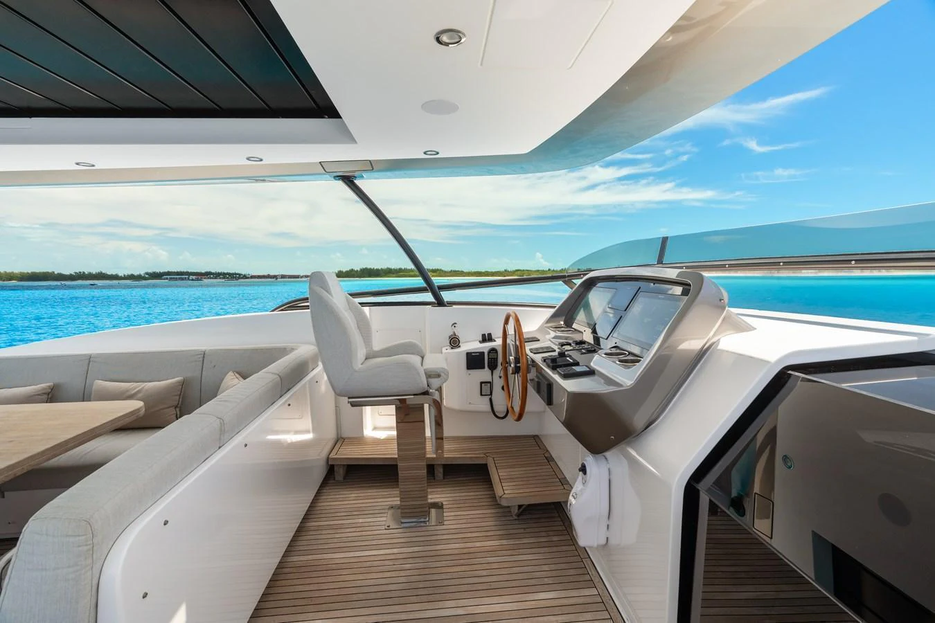 The helm station offers a sleek and modern design with panoramic views of the surrounding waters. aboard LIFE Yacht for Sale