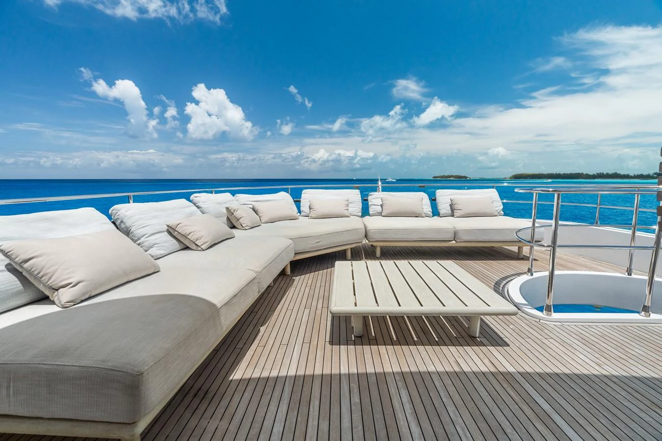 The sundeck offers a spacious and inviting lounging area with plush seating and stunning ocean views. aboard LIFE Yacht for Sale