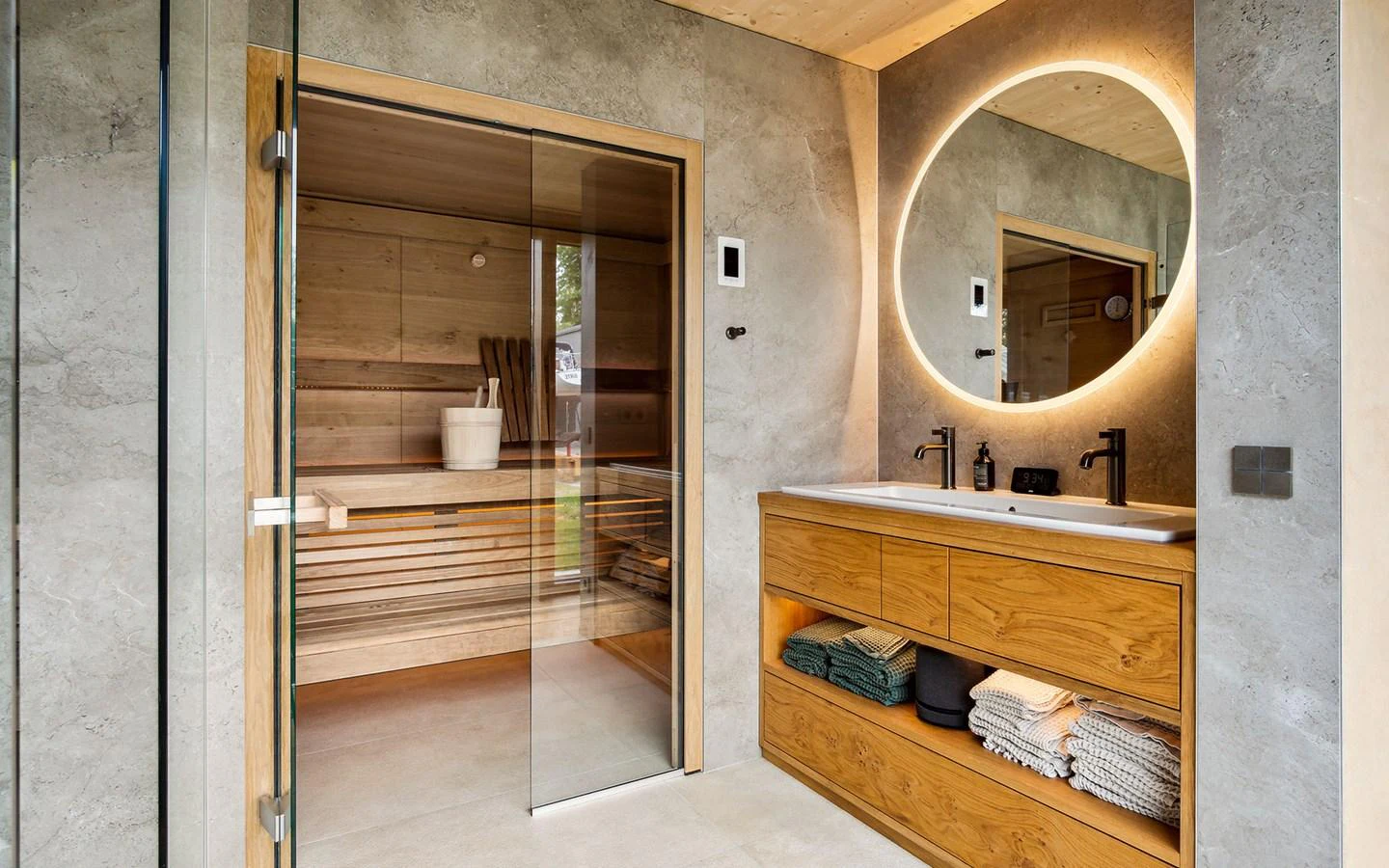 The yacht's bathroom features a modern design with a sauna and elegant lighting. aboard OHANA Yacht for Sale