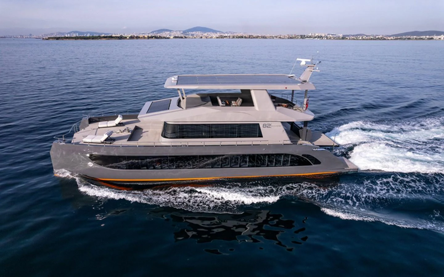 A sleek and modern yacht cruises smoothly on calm waters, showcasing its elegant design and spacious decks. aboard SITARA Yacht for Sale