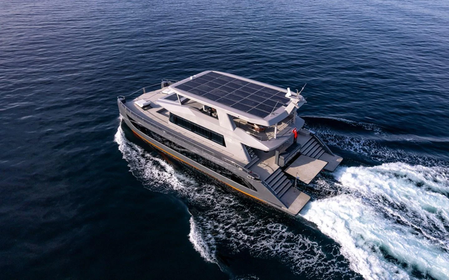 A sleek, modern yacht cruises through the open water, showcasing its impressive design and spacious decks. aboard SITARA Yacht for Sale