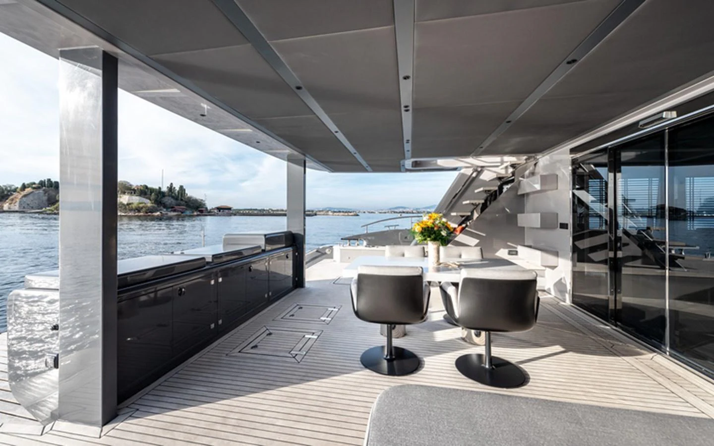 The aft deck offers a stylish and spacious area for alfresco dining with stunning views of the water. aboard SITARA Yacht for Sale