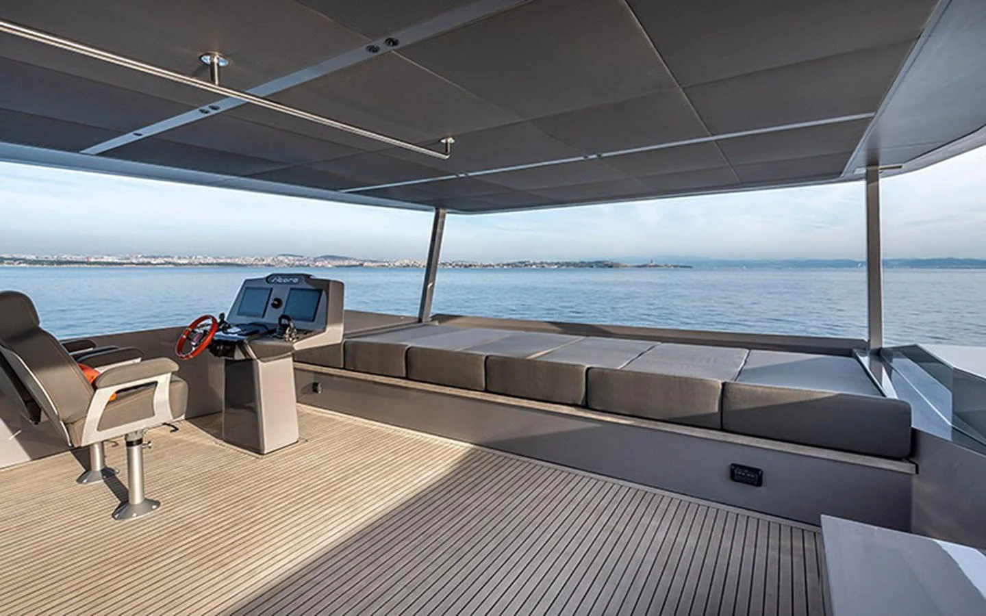 The flybridge offers a spacious and shaded area with comfortable seating and panoramic views of the sea. aboard SITARA Yacht for Sale