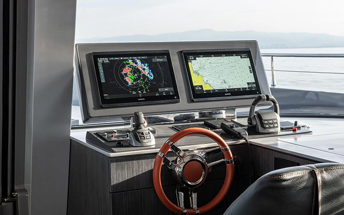 The helm station features advanced navigation equipment and a sleek steering wheel, offering a commanding view for the captain. aboard SITARA Yacht for Sale