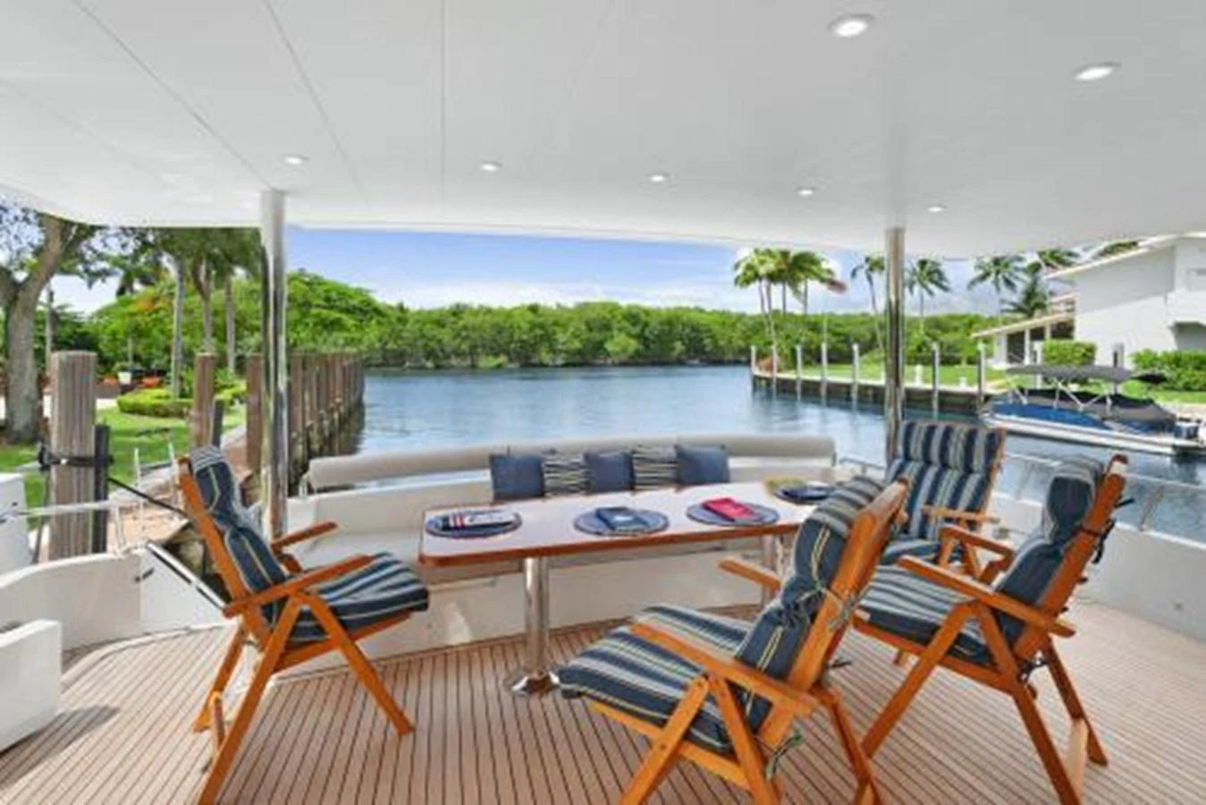 The aft deck offers a serene outdoor dining area with comfortable seating and a beautiful view of the water. aboard SUE CAROLYN Yacht for Sale