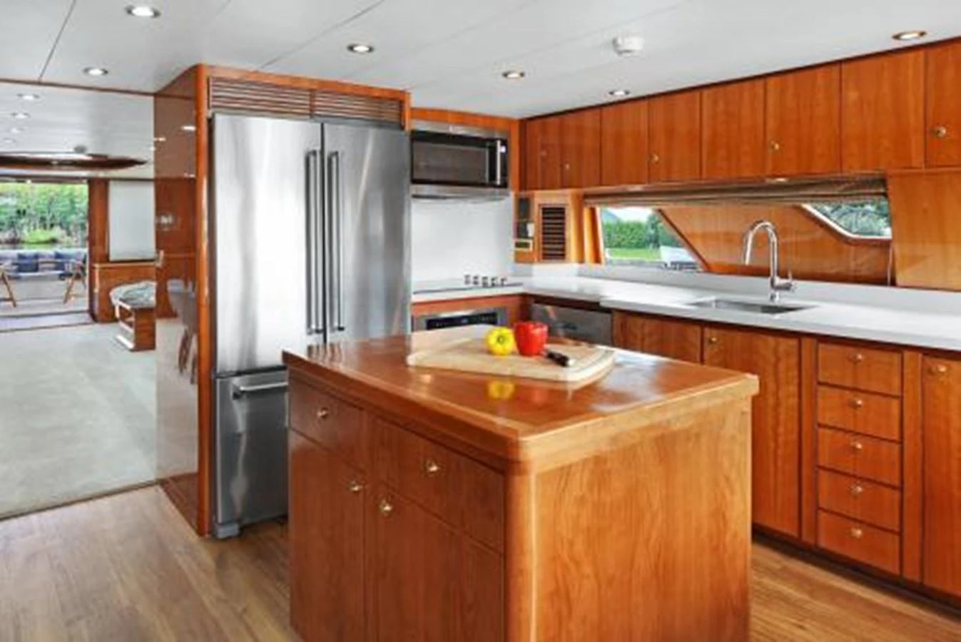 The yacht's galley features modern appliances and ample wooden cabinetry, creating a warm and functional space. aboard SUE CAROLYN Yacht for Sale