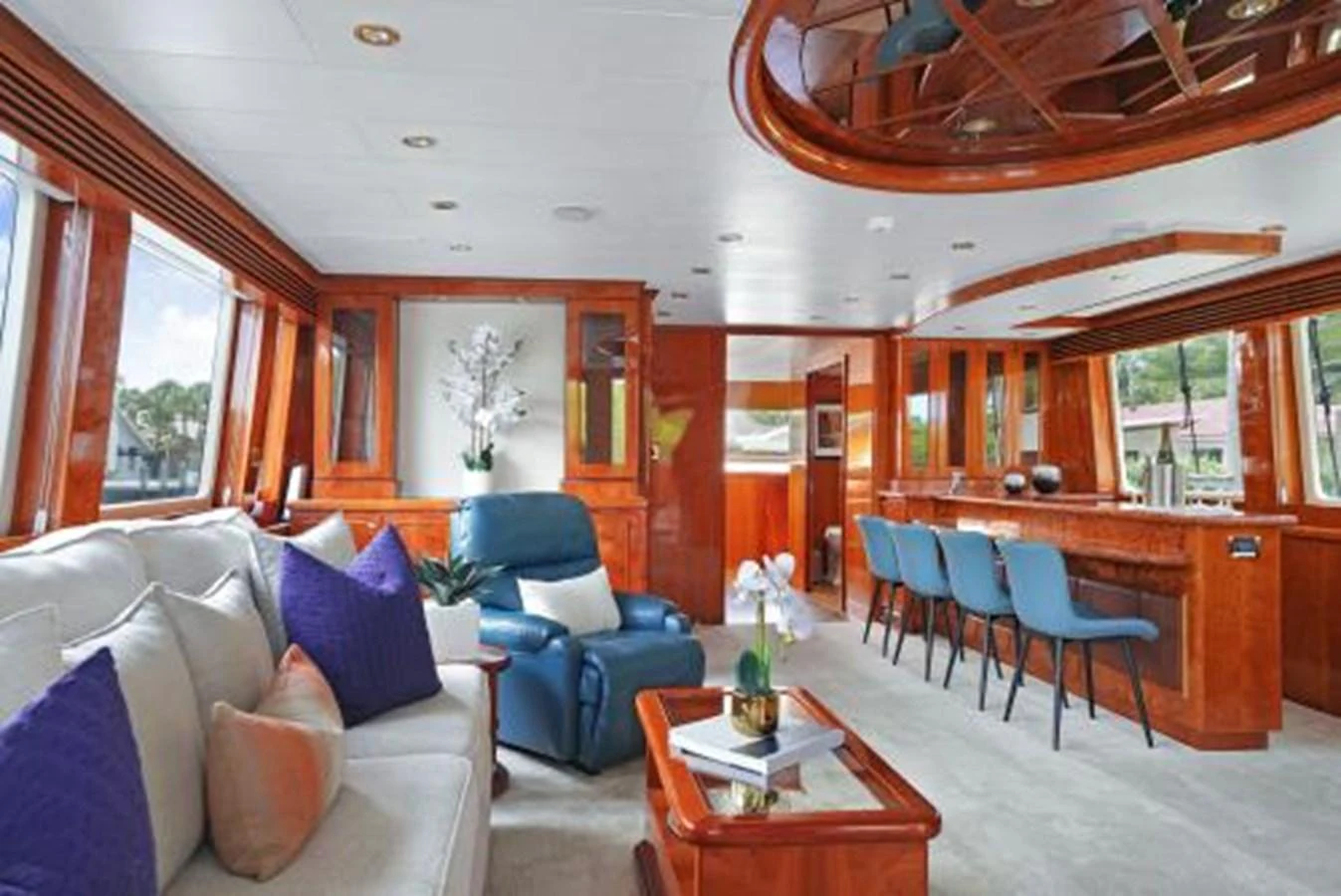 The yacht's salon features elegant woodwork, comfortable seating, and large windows for natural light. aboard SUE CAROLYN Yacht for Sale