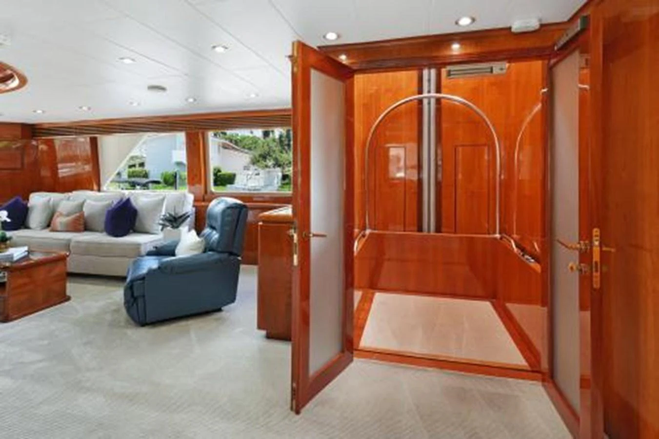 The salon features luxurious seating and elegant wooden finishes, creating a warm and inviting atmosphere. aboard SUE CAROLYN Yacht for Sale
