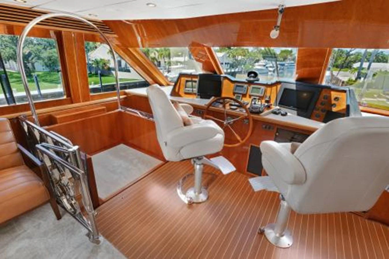 The helm station features luxurious seating and state-of-the-art navigation equipment. aboard SUE CAROLYN Yacht for Sale