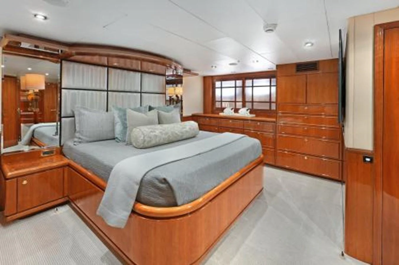 The master stateroom features a luxurious bed with elegant wood finishes and ample storage space. aboard SUE CAROLYN Yacht for Sale