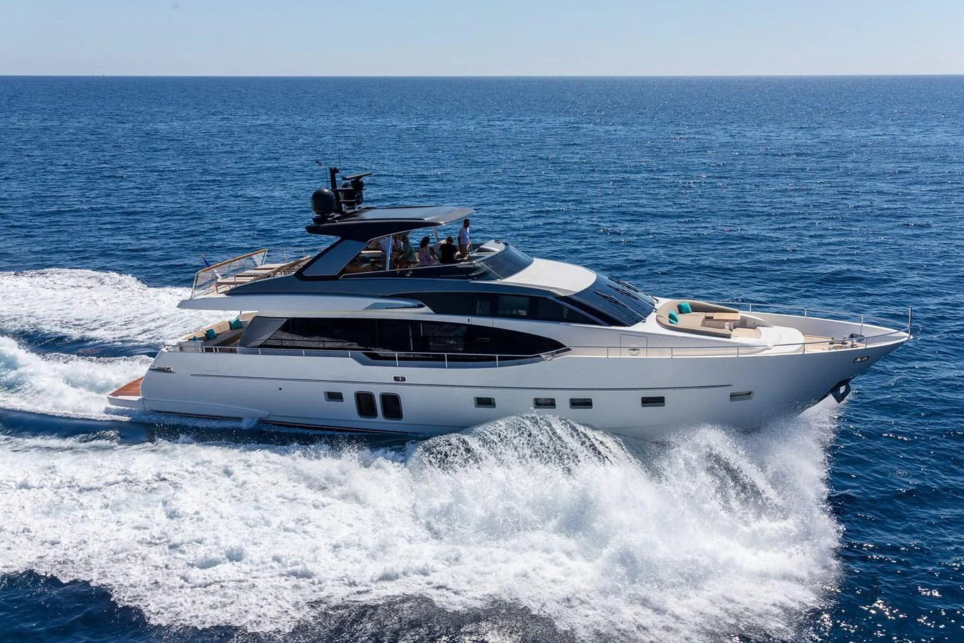 A sleek and modern yacht cruises swiftly through the open sea, showcasing its elegant design and powerful performance. aboard REGINE OF CANNES Yacht for Sale