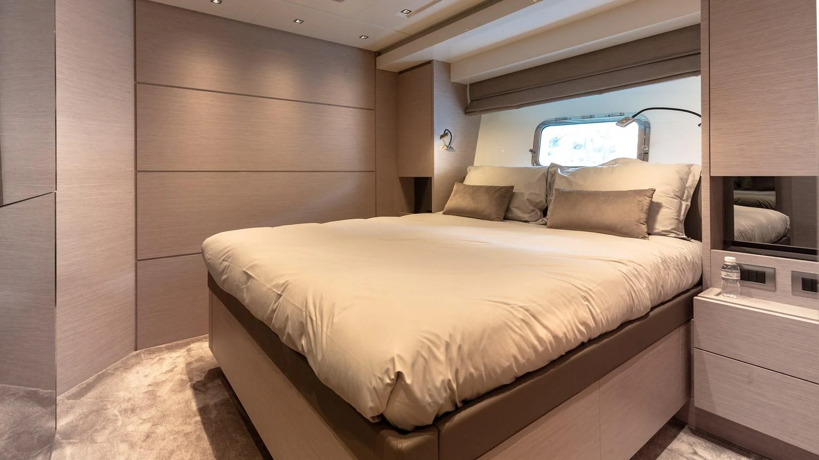 A luxurious stateroom featuring a plush bed and modern design elements. aboard REGINE OF CANNES Yacht for Sale