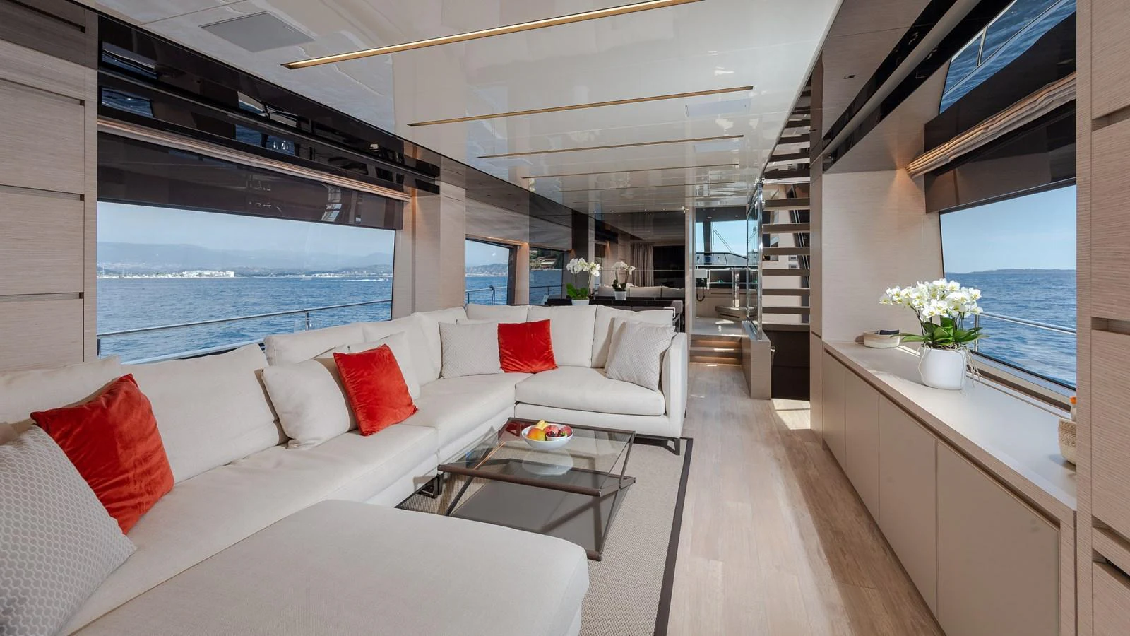 The salon offers a spacious and elegant seating area with panoramic views of the sea. aboard REGINE OF CANNES Yacht for Sale
