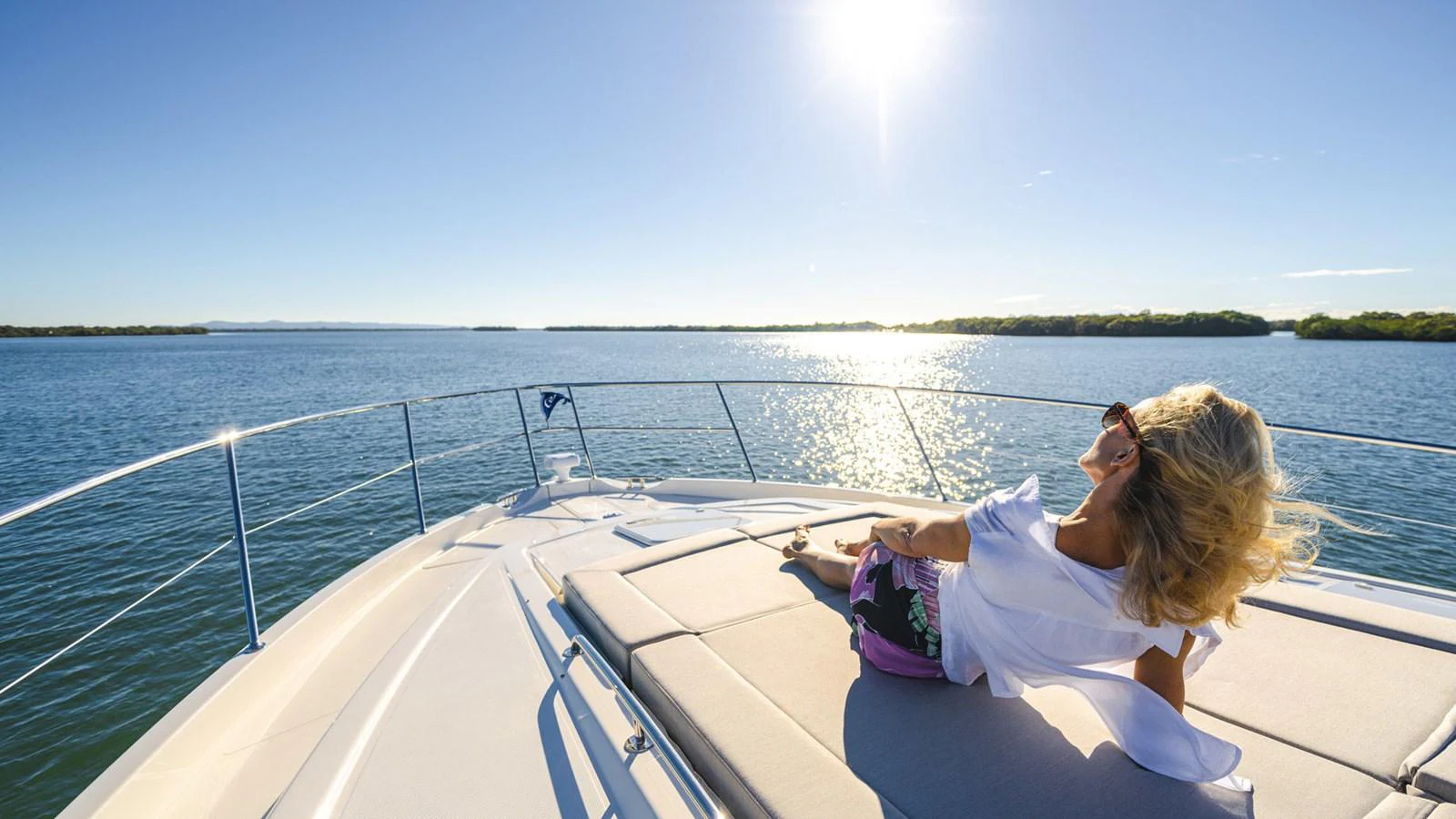 a woman sitting on a boat aboard 6800 SPORT YACHT Yacht for Sale