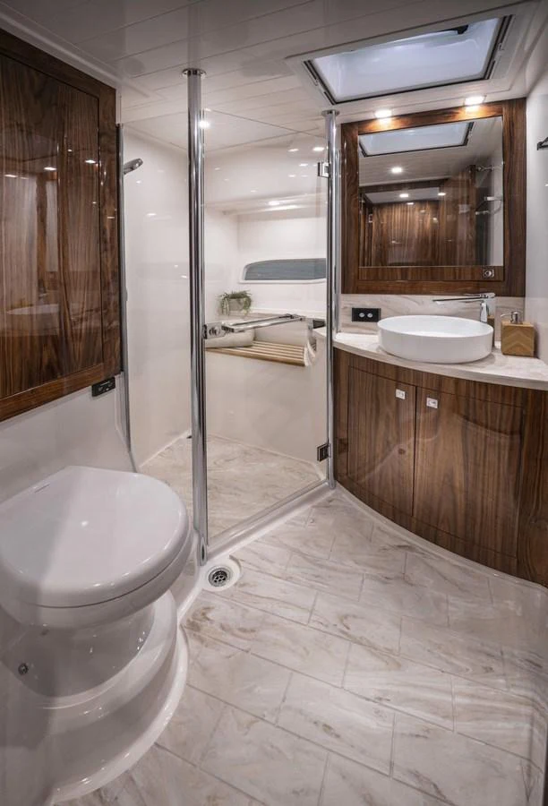 a bathroom with a glass shower aboard 6800 SPORT YACHT Yacht for Sale