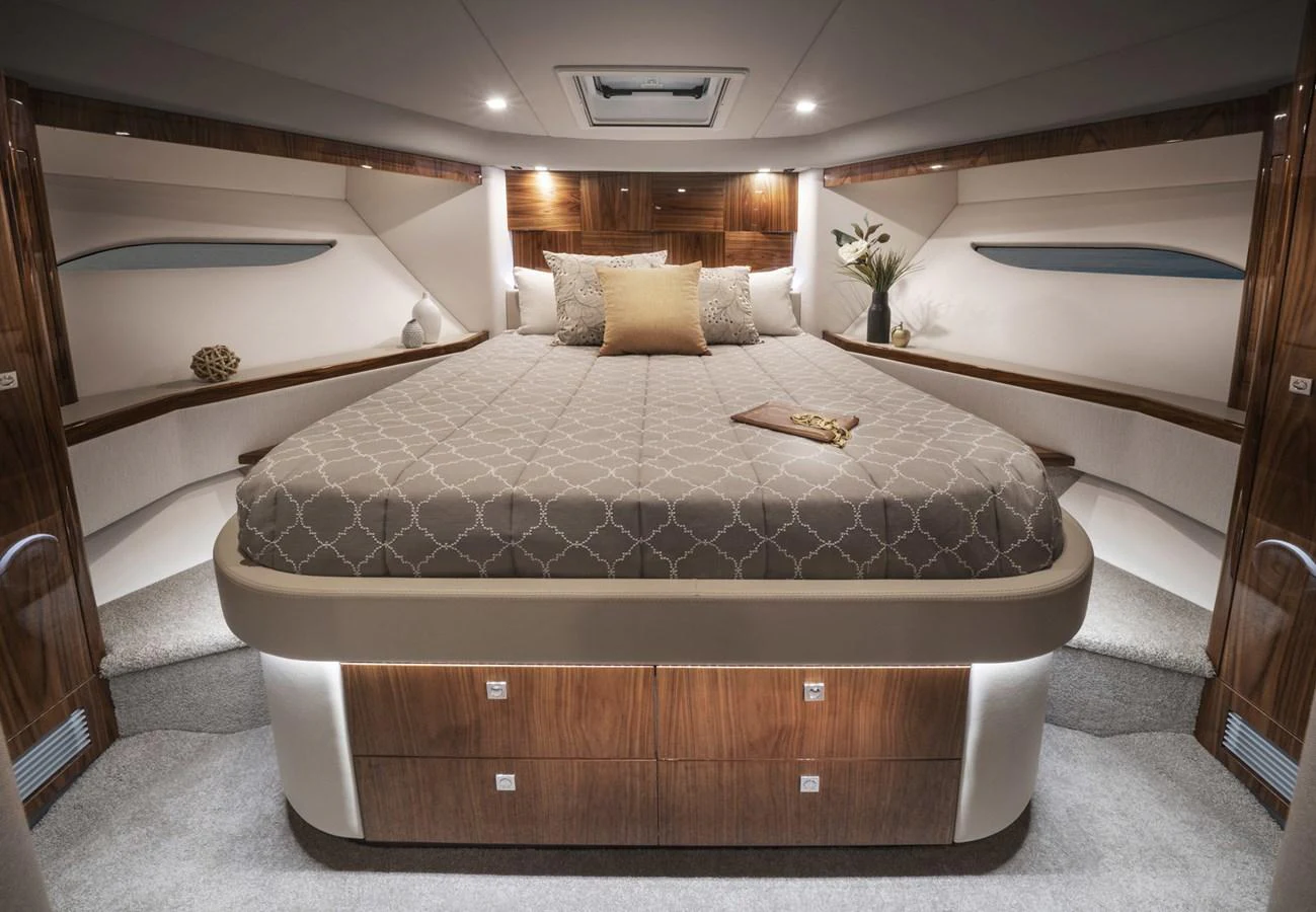 a large bed in a room aboard 6800 SPORT YACHT Yacht for Sale