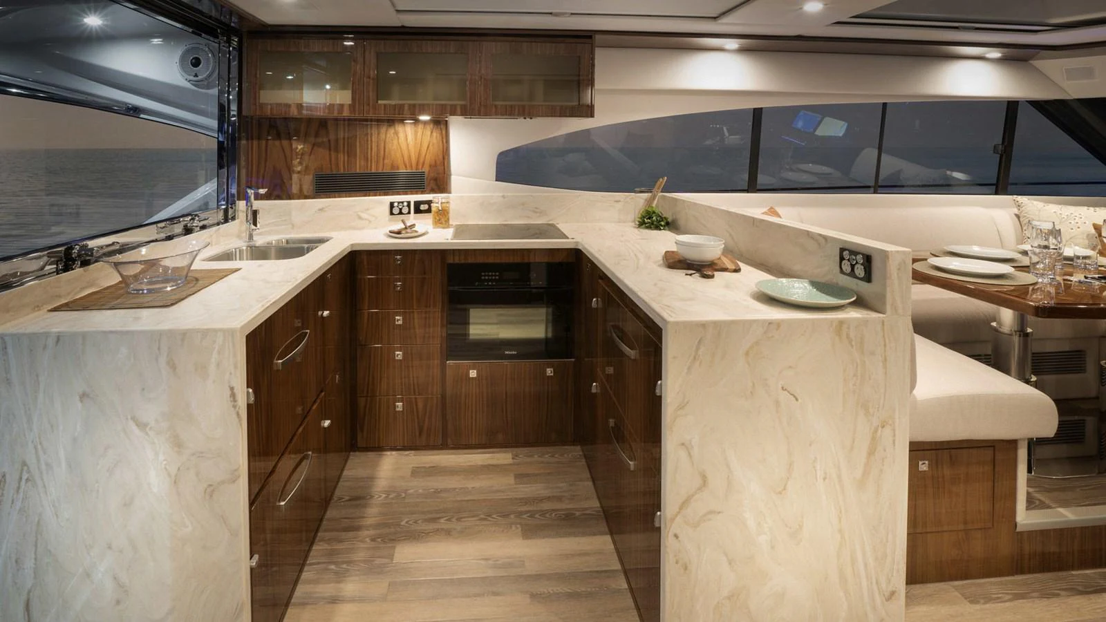 a kitchen with a large island aboard 6800 SPORT YACHT Yacht for Sale