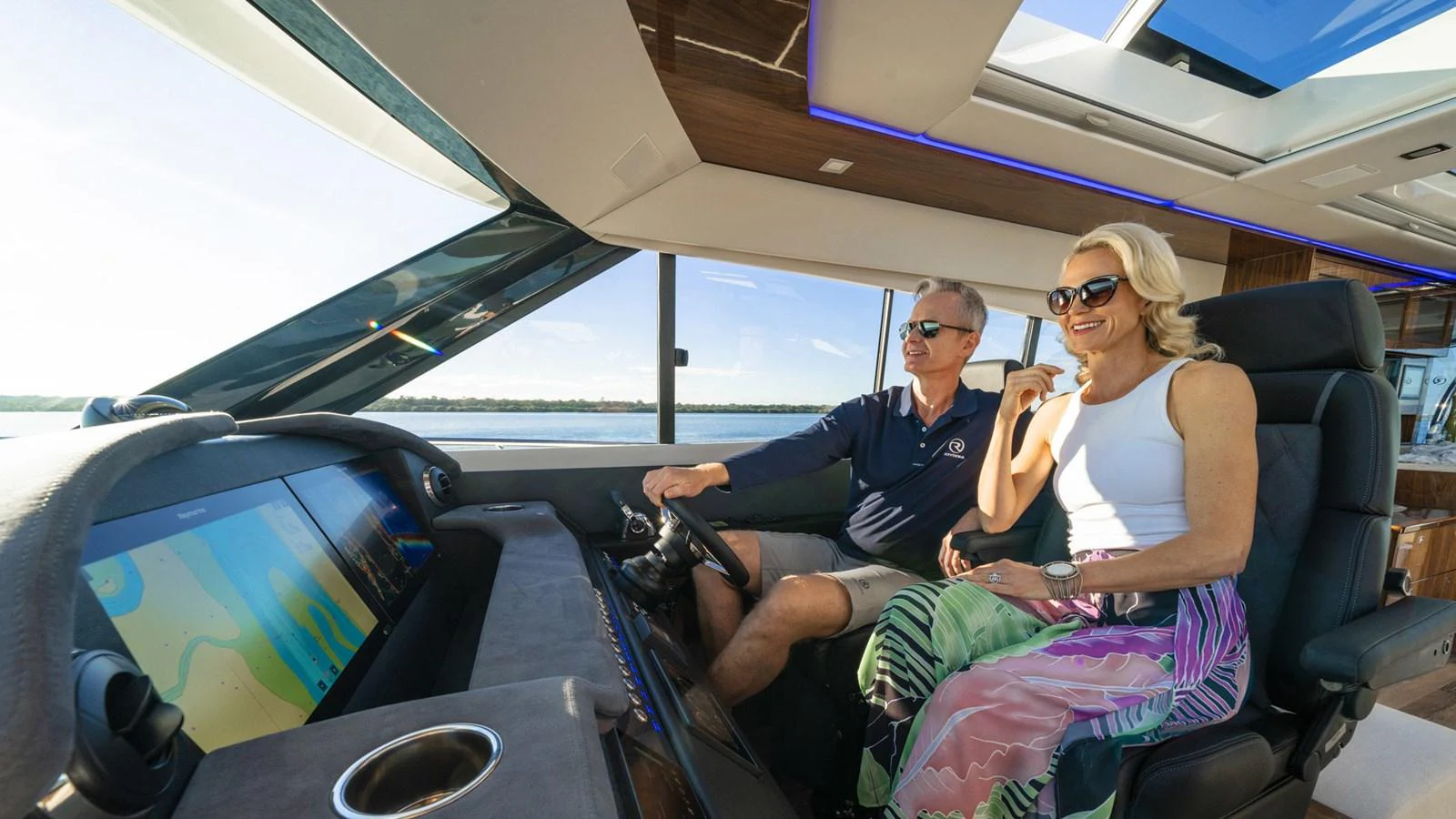 a man and woman sitting in a car aboard 6800 SPORT YACHT Yacht for Sale