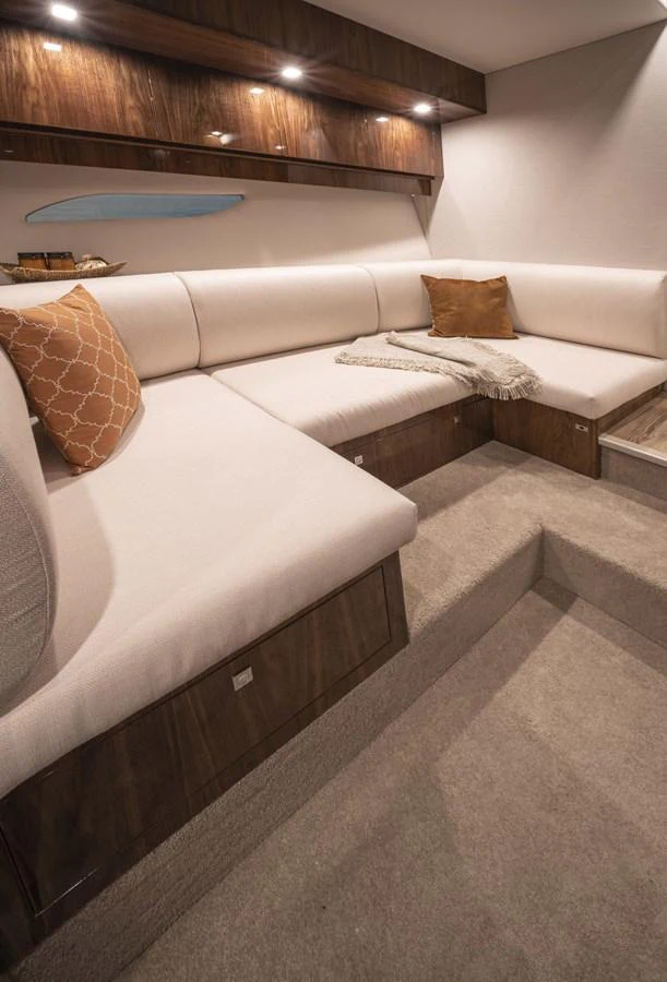 a bed with a wooden headboard aboard 6800 SPORT YACHT Yacht for Sale