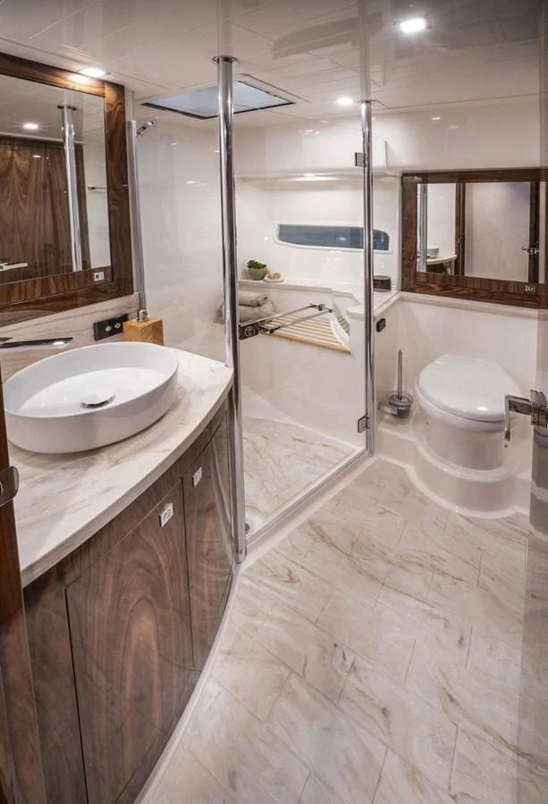 a bathroom with a glass shower aboard 6800 SPORT YACHT Yacht for Sale