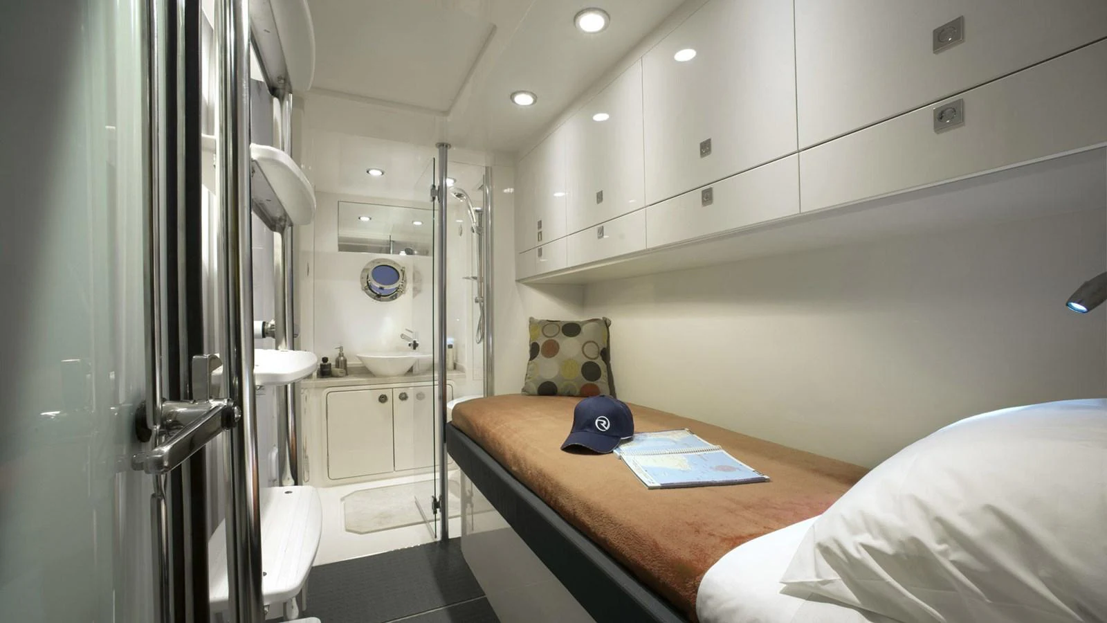 a bathroom with a bed and a mirror aboard 6800 SPORT YACHT Yacht for Sale