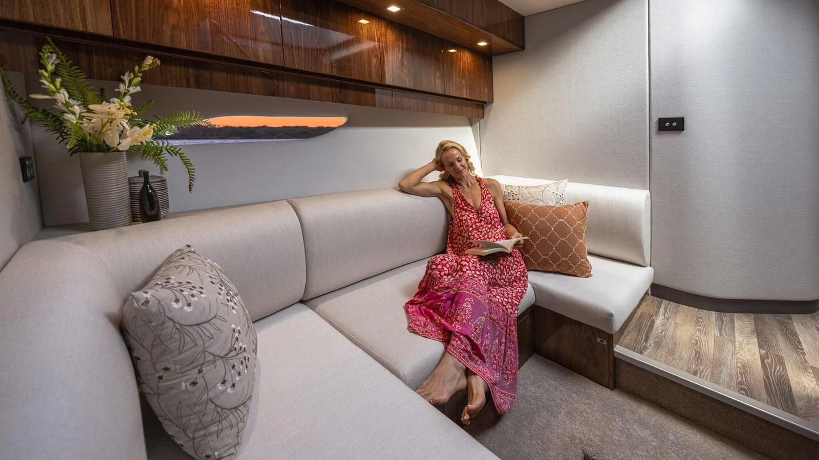 a person sitting on a couch aboard 6800 SPORT YACHT Yacht for Sale