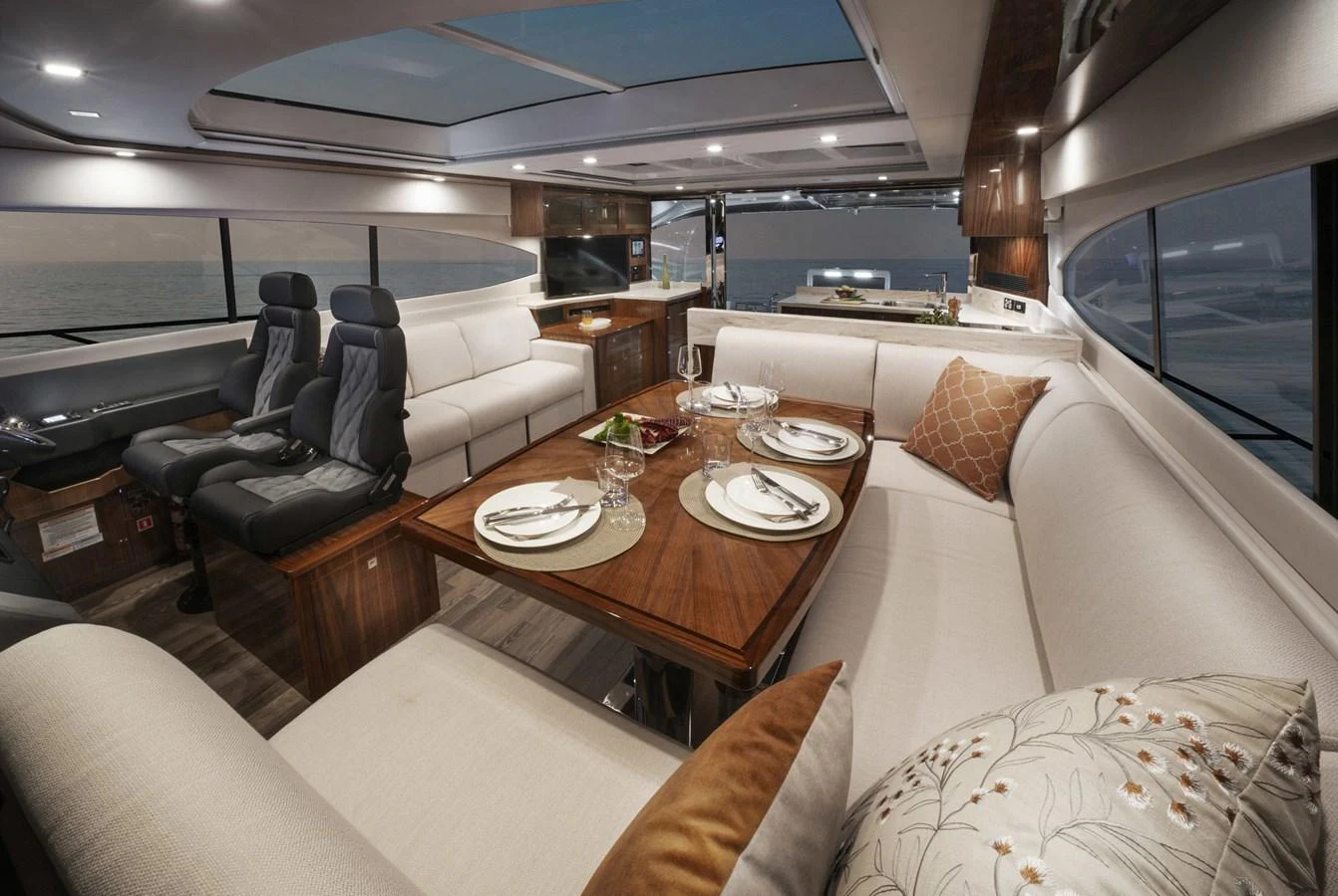 a living room with a table and chairs aboard 6800 SPORT YACHT Yacht for Sale