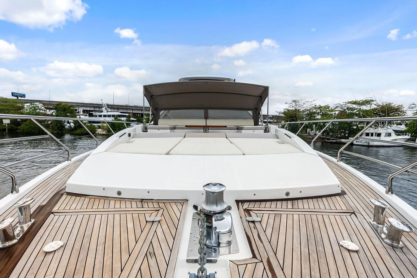 The yacht's foredeck features spacious sun pads and elegant teak decking, perfect for relaxation. aboard CLASS DISMISSED Yacht for Sale
