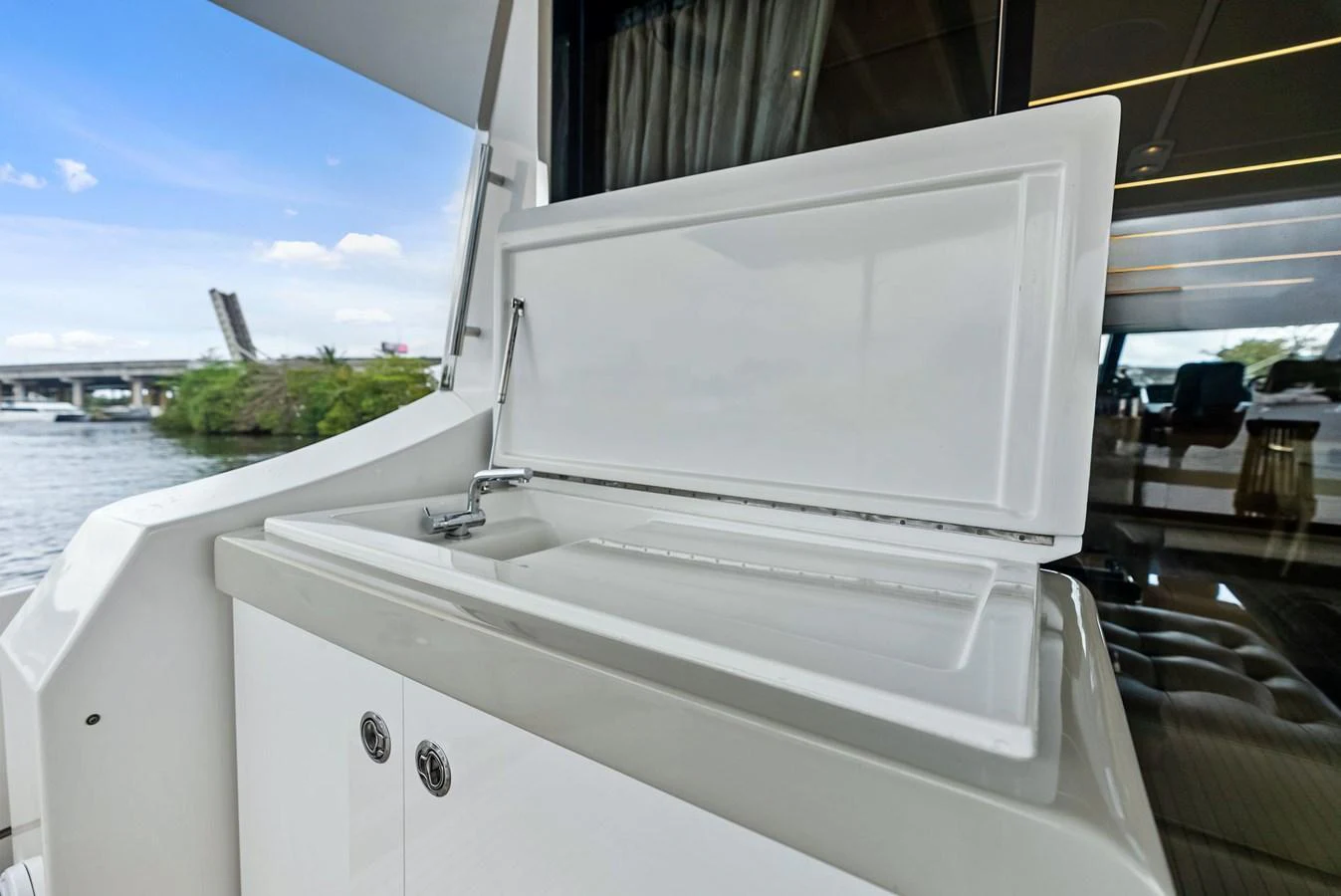 A pristine white sink area on the yacht, perfect for outdoor entertaining. aboard CLASS DISMISSED Yacht for Sale