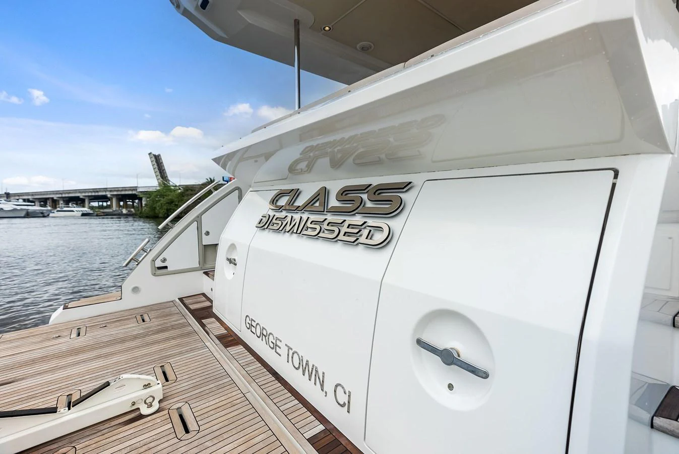 A close-up view of the yacht's stern showcasing its name and registration details. aboard CLASS DISMISSED Yacht for Sale