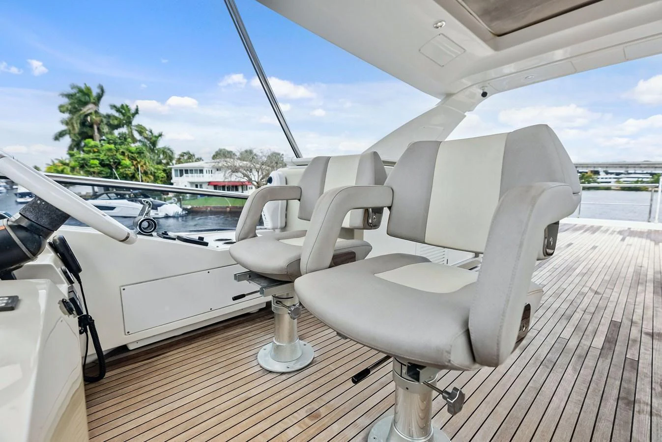 The helm area features comfortable seating with a view of the surrounding waters. aboard CLASS DISMISSED Yacht for Sale