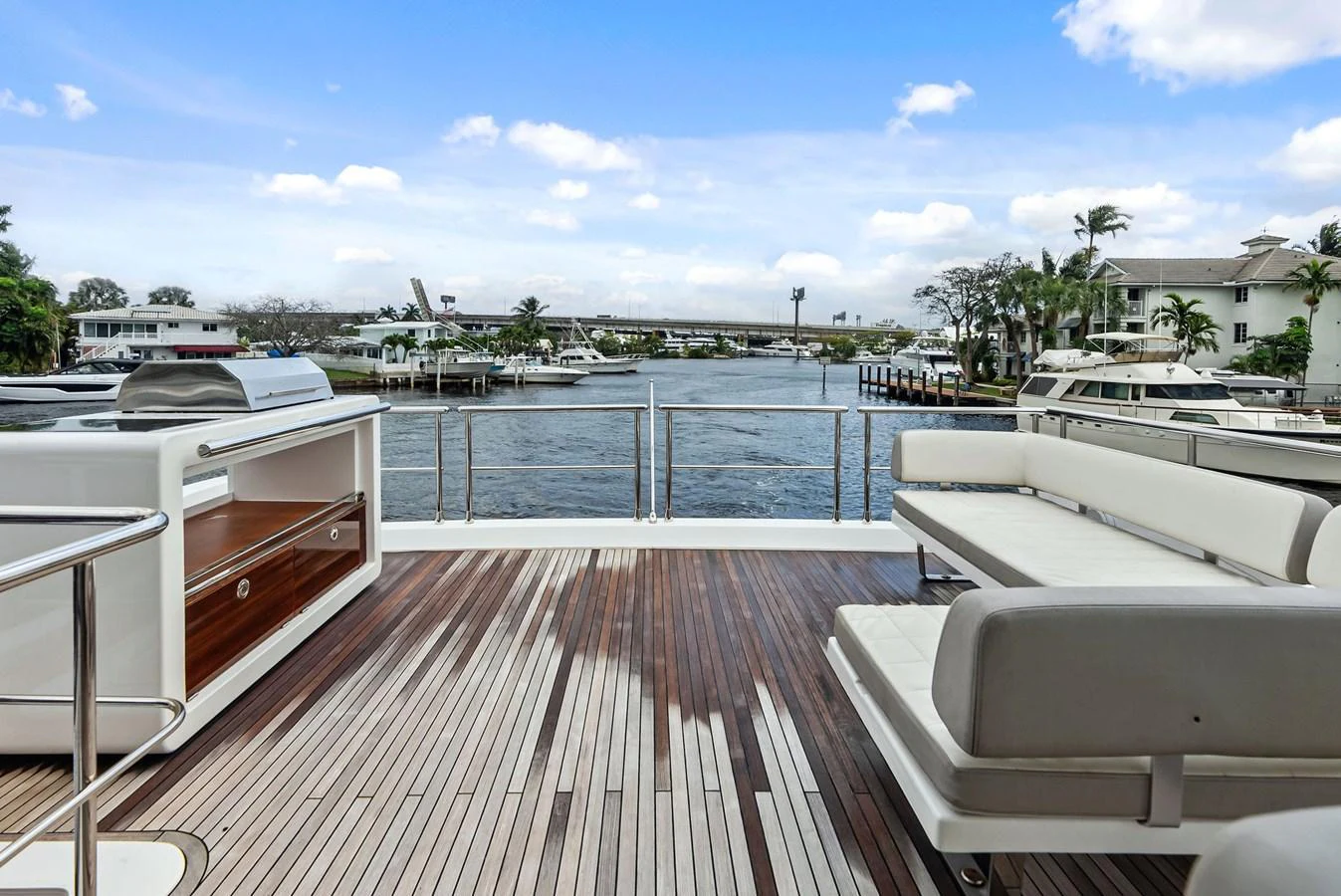 The aft deck offers a spacious and inviting area with comfortable seating and a beautiful view of the water. aboard CLASS DISMISSED Yacht for Sale