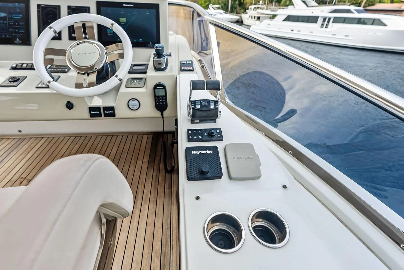 The helm station features modern navigation equipment and luxurious finishes. aboard CLASS DISMISSED Yacht for Sale