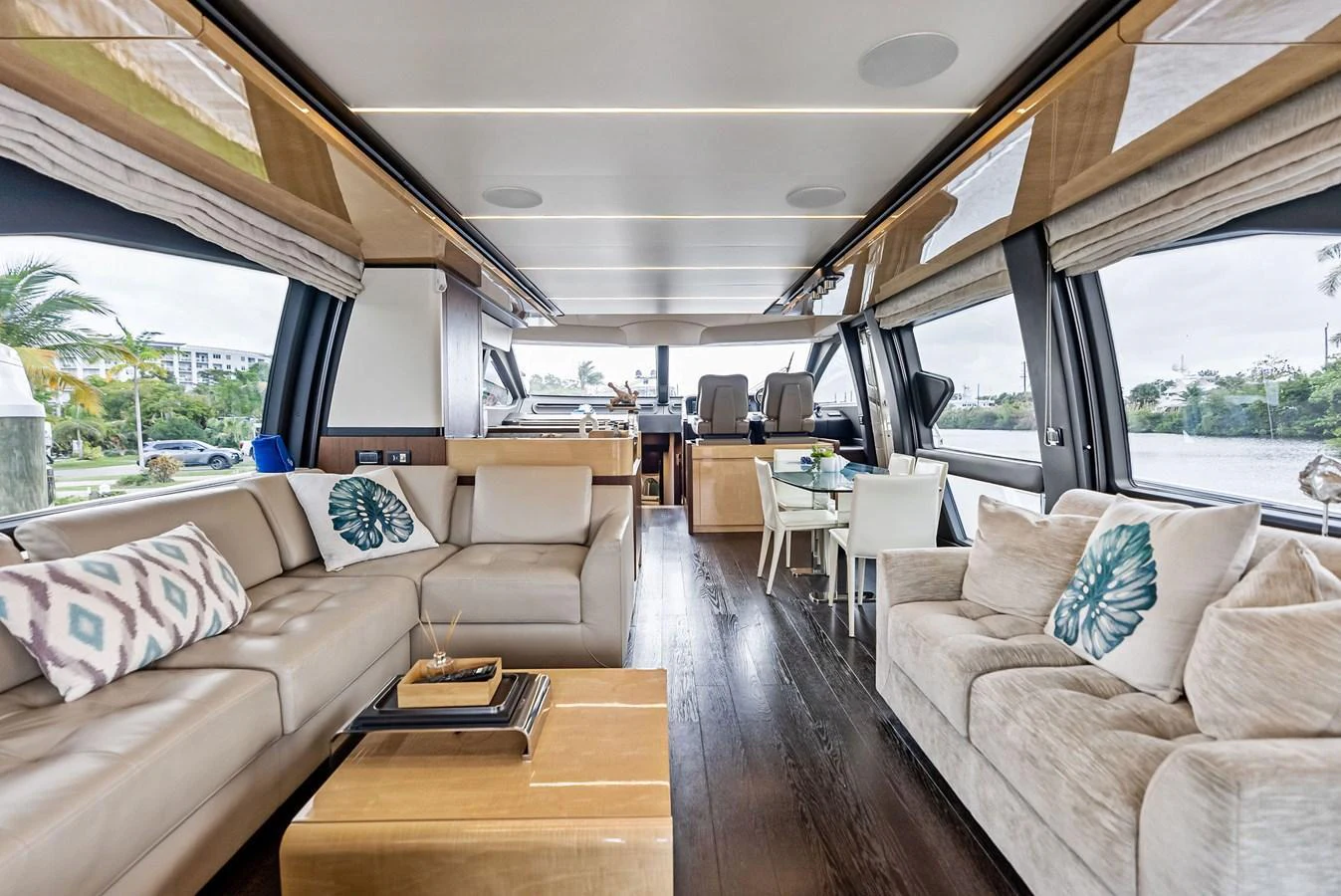 The salon offers a spacious and luxurious seating area with large windows providing ample natural light and scenic views. aboard CLASS DISMISSED Yacht for Sale