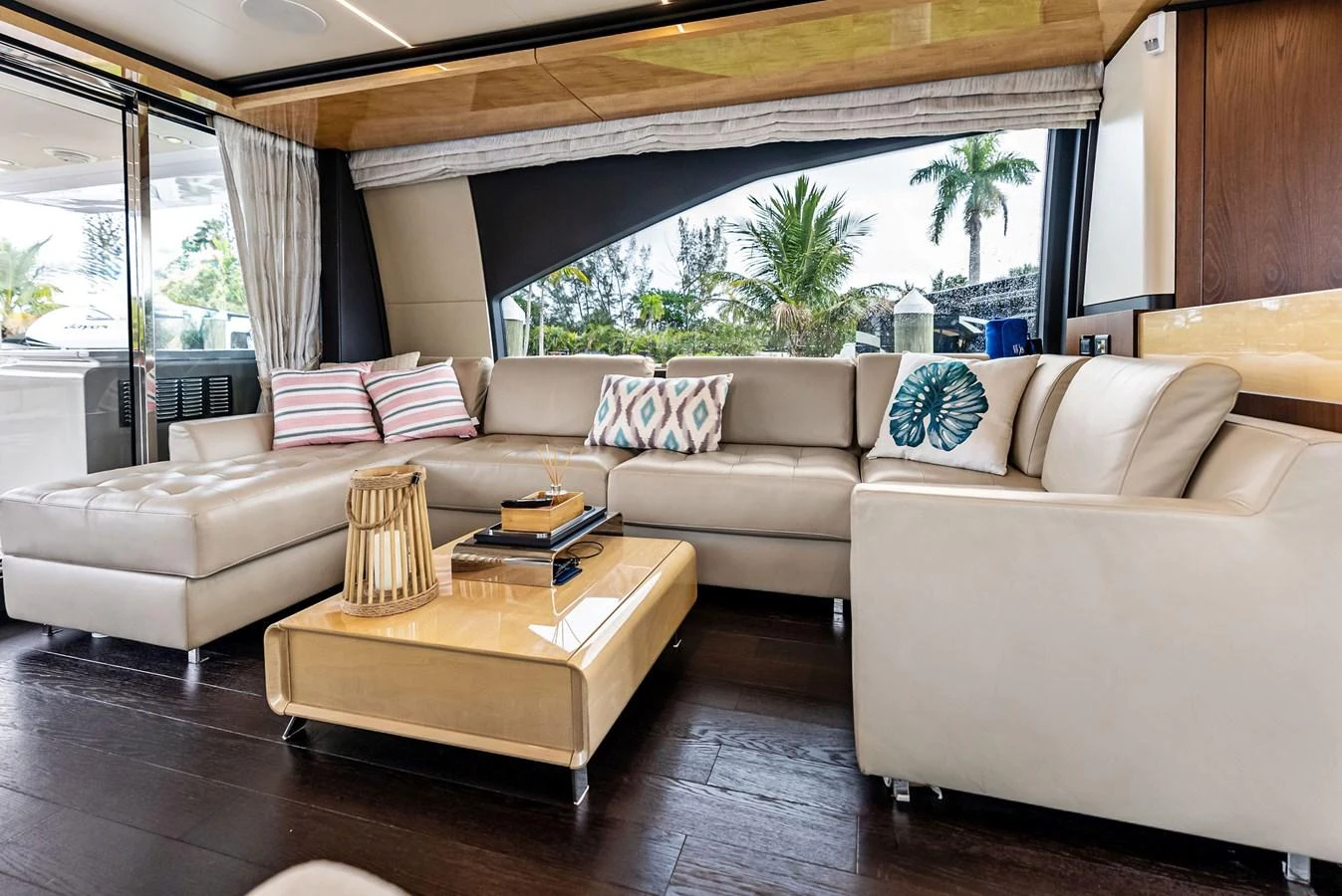 The salon features a spacious and elegant seating area with plush sofas and stylish decor. aboard CLASS DISMISSED Yacht for Sale