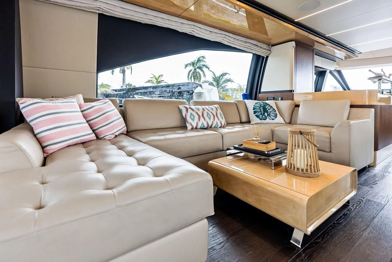 The salon features luxurious leather seating with stylish decor and ample natural light. aboard CLASS DISMISSED Yacht for Sale