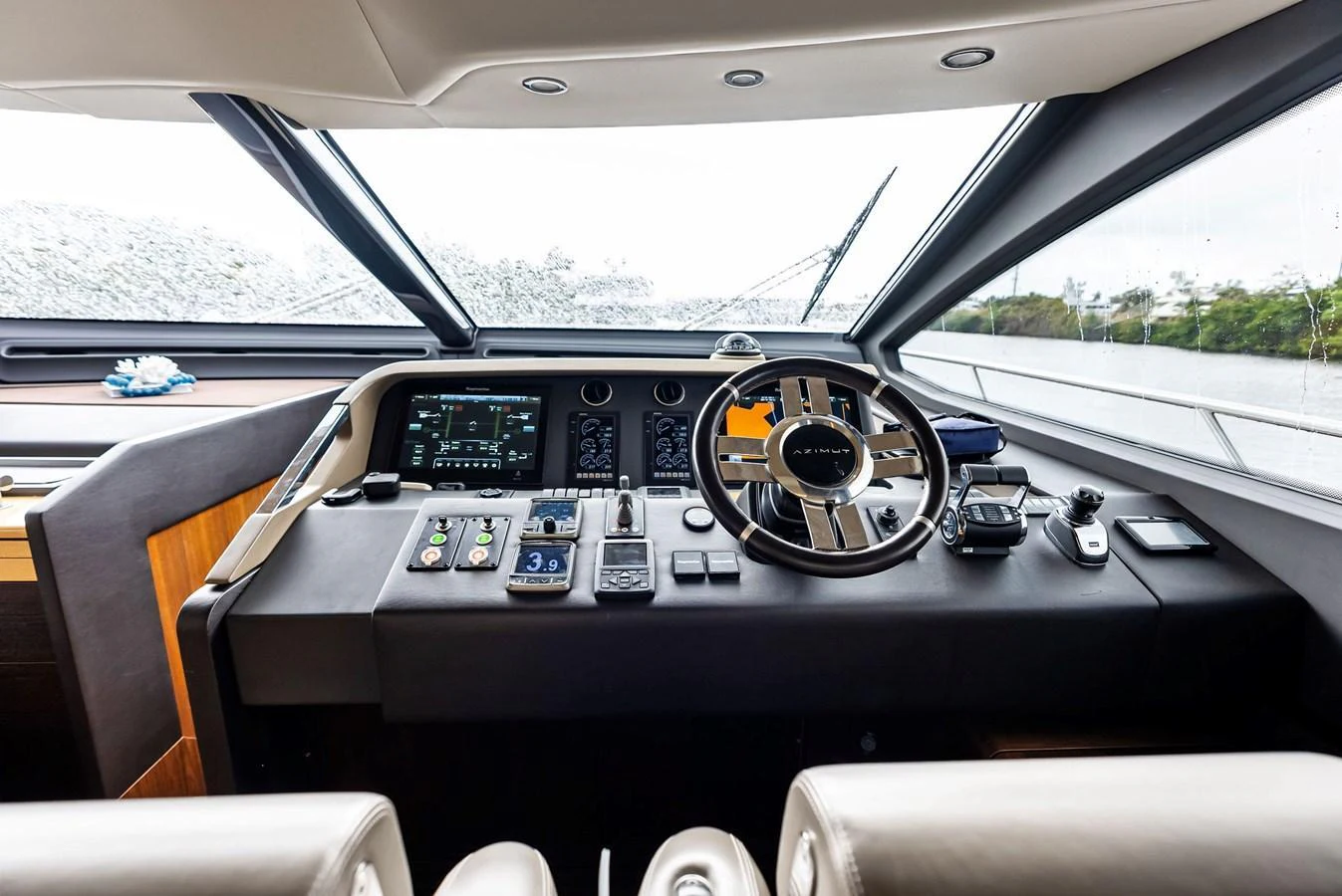 The helm station features advanced navigation equipment and a sleek design. aboard CLASS DISMISSED Yacht for Sale