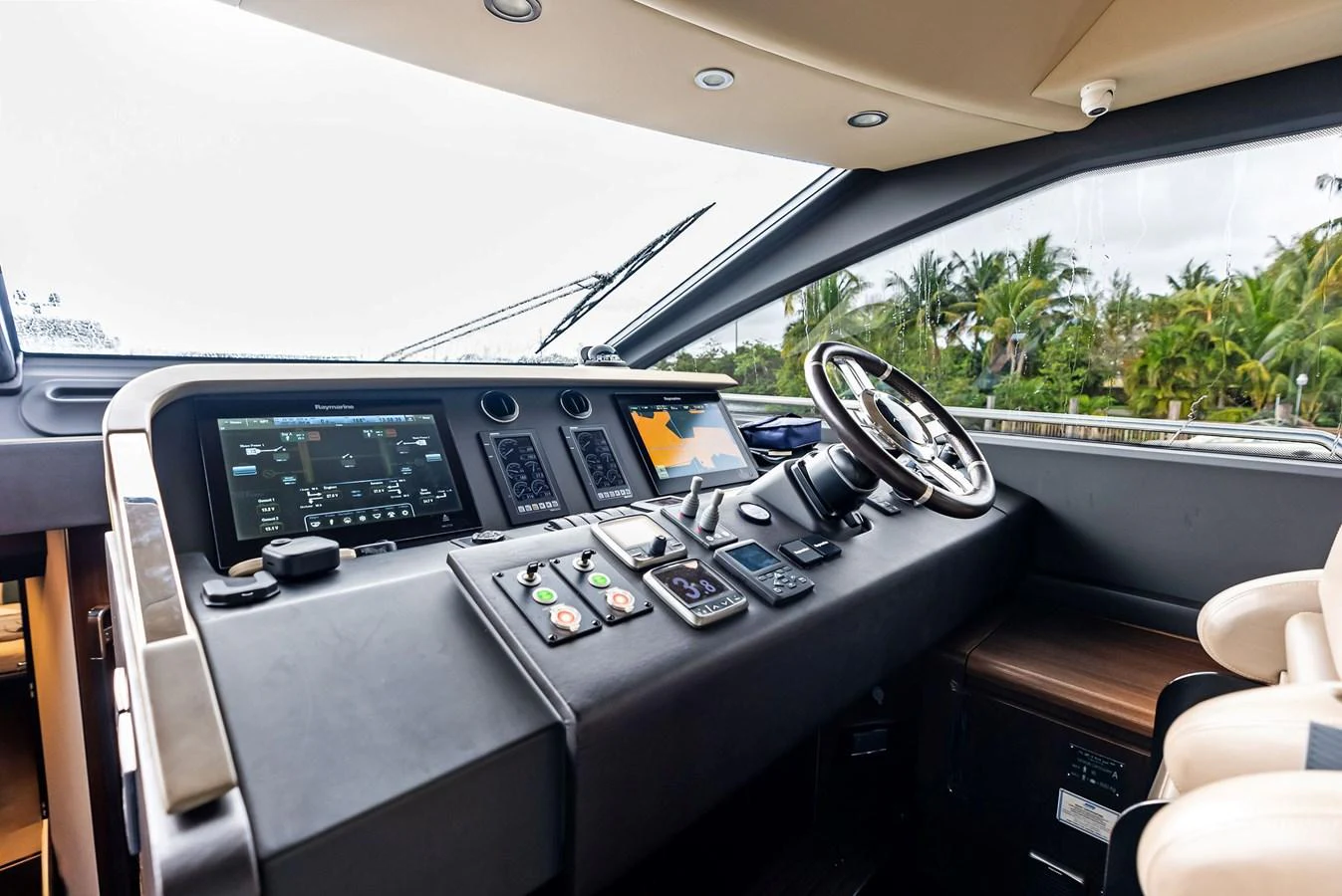 The helm station features advanced navigation equipment and luxurious seating, offering a commanding view for the captain. aboard CLASS DISMISSED Yacht for Sale
